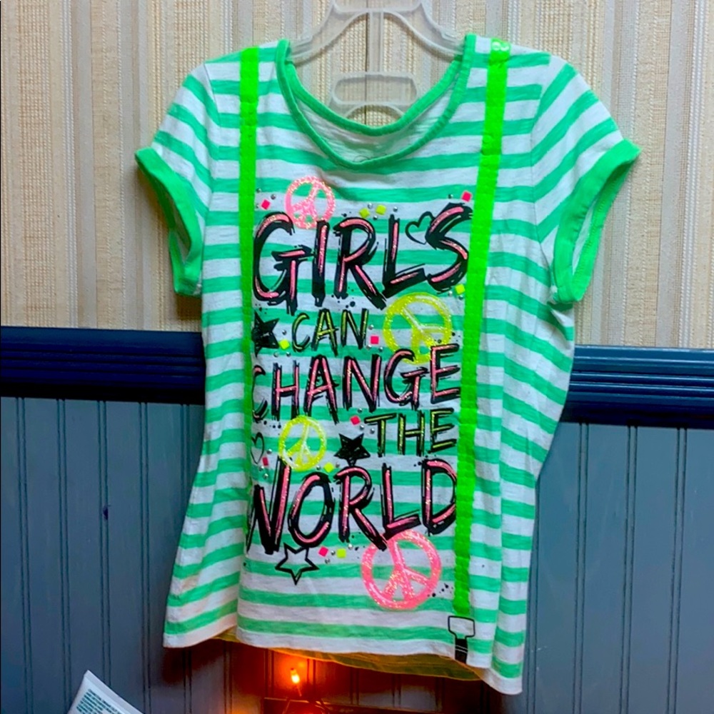 A green t shirt with letter prints on it